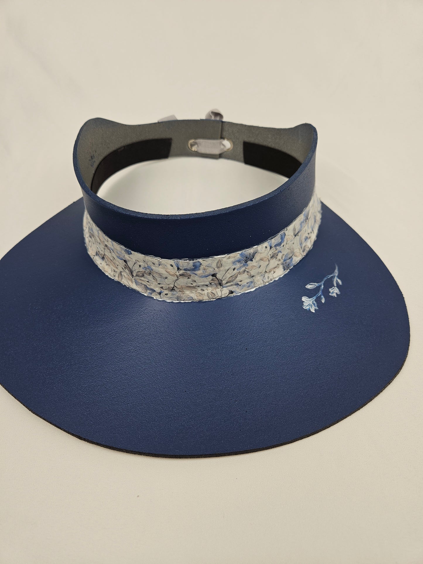 Classic Navy Audrey Foam Sun Visor Hat with Blue Floral Band and Handpainted Floral Motif: Big Brim, Golf, Swim, UV Resistant, No Headache