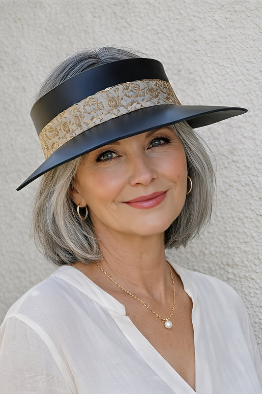 Woman wearing a stylish hat against a plain background