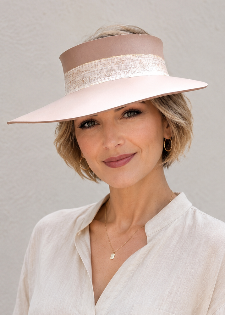 Woman wearing a wide-brimmed hat with a white background